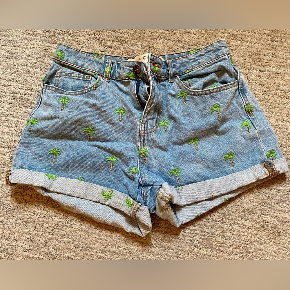 Denim shorts with palm tree detail. Size 6.